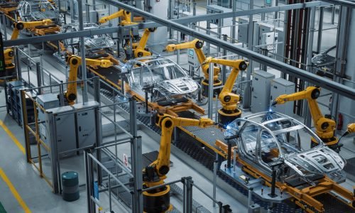 Car Factory 3D Concept: Automated Robot Arm Assembly Line Manufacturing High-Tech Green Energy Electric Vehicles. Construction, Building, Welding Industrial Production Conveyor. Elevated Wide Shot